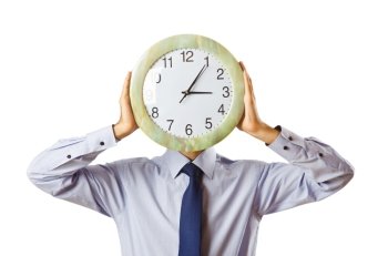 Businessman covering his face with clock