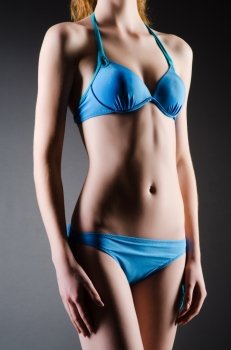 Attractive woman in blue bikini