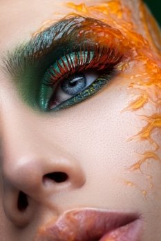 Face with creative make-up close-up