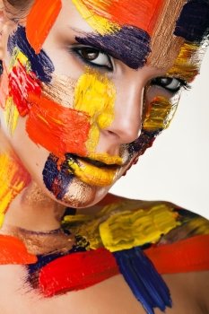 attractive brunette in colourful paint