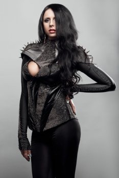 Fashion shot of a woman in corset with spikes