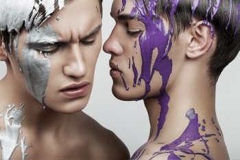 two men in violet and silver paint