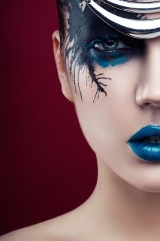 woman with black and blue make-up