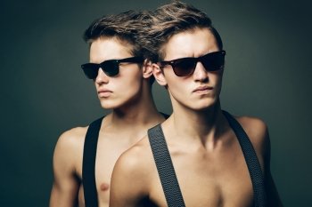 two serious men in sunglasses