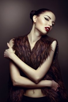 close-up portrait of a beautiful girl in a fur coat