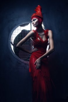 fashion woman in red hat in circle of light