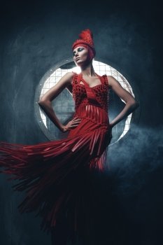 glamour woman in red in circle of light