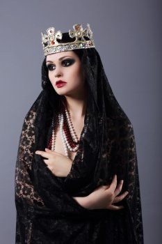Witchcraft. Woman in Old-Fashioned Clothes and Crown