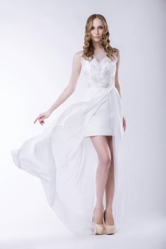 Elegance. Gorgeous Bride in Luxurious Dress