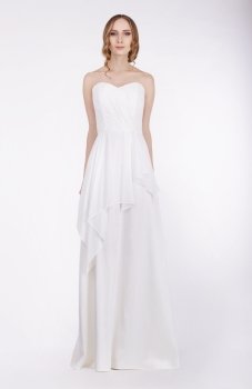 Fashion Model Standing in Long White Dress
