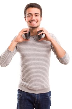 Happy young man with headphones on and listening to music