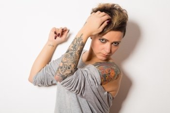 Studio shot of a young tattooed woman 