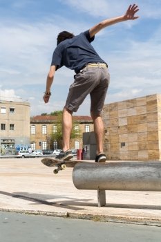 Young boy skateboarder at the local skatepark