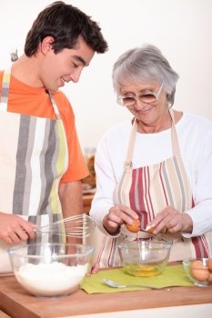 Grandmother and grandson cooking