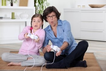Mother and daughter playing games