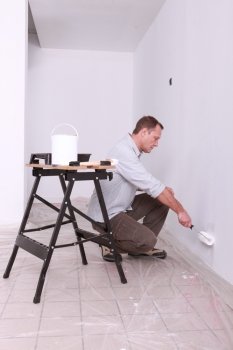 Man painting a wall