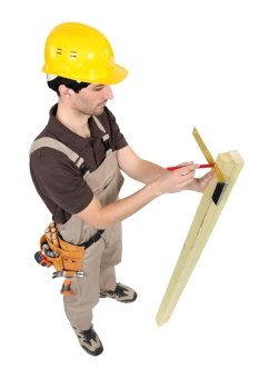 Carpenter using a angle iron.