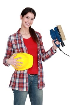 Woman holding a sander