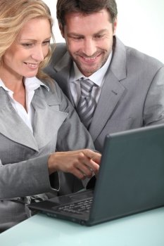 Executives with laptop computer