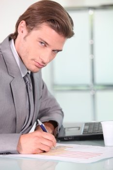 Young businessman analysing