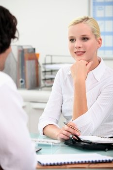 Woman chatting to a colleague