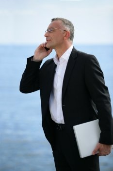 executive on the phone profile-view