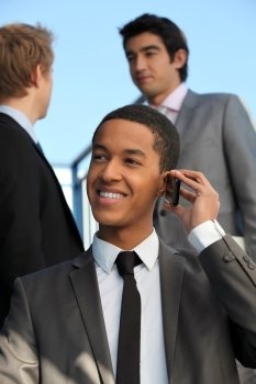 Young businessman talking on his mobile phone