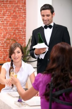 Women drinking champagne in a restaurant