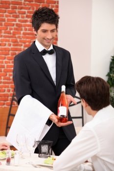 Sommelier presenting a wine