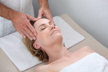 Blond woman receiving massage
