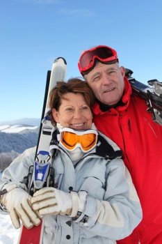 two seniors skiing in the mountain