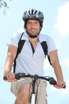 Young on bike with helmet