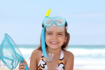 Little girl with snorkel and flippers