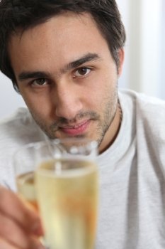 Man holding glass of champagne