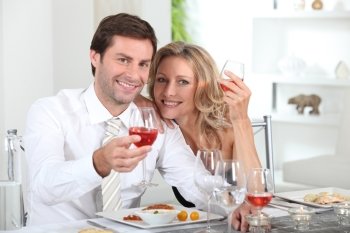 Couple eating meal at table