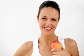 Beautiful woman holding apple on white background