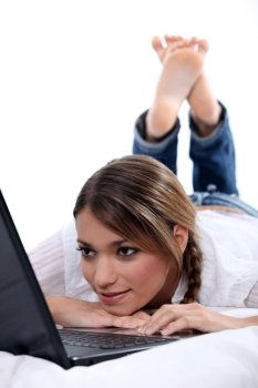 woman lying with computer