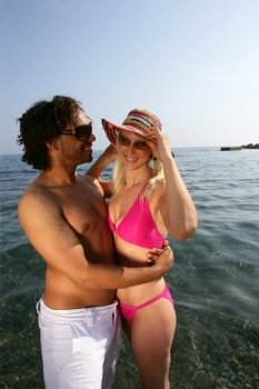 Young couple embracing in the sea