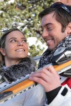 smiling young couple at ski