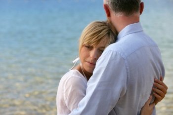 blonde woman hugging her husband