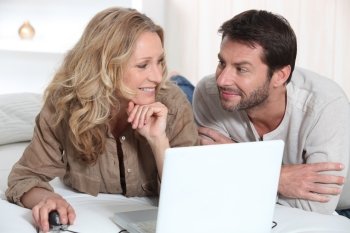 Couple using a laptop