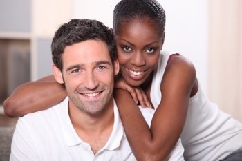 Mixed race couple indoors