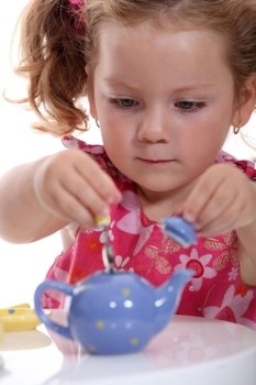 Girl with toy teapot