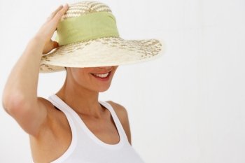Smiling woman wearing straw hat