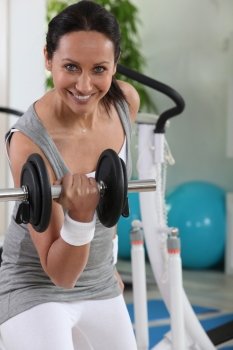 Woman using a dumbbell