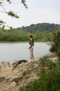 Woman on a riverbank