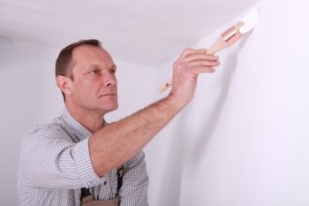 Man repainting home walls