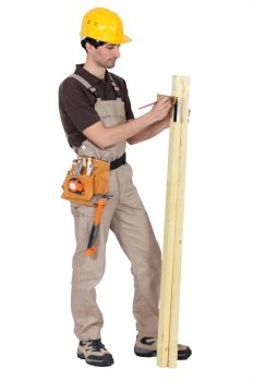 Tradesman using a try square to measure an angle