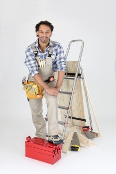 Carpenter with equipment, studio shot