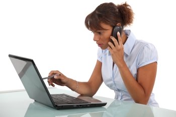 Woman telephoning technical help desk
